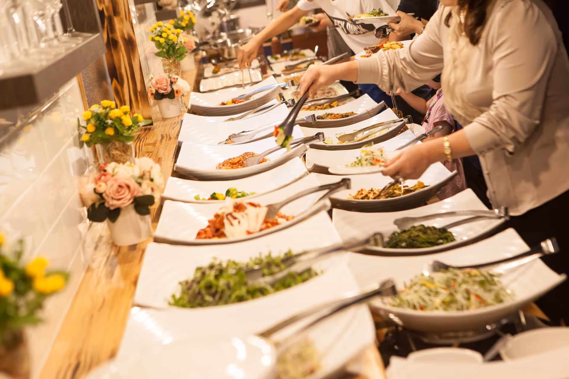 Restaurant buffet line with food and people
